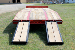E-Z Flip ramps shown positioned inboard make loading of narrower machines safe and easy.