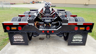 A view from behind the trailer (including the removable/flip 4th axle) shows the lowered 