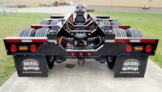 A view from behind the trailer (including the removable/flip 4th axle) shows the lowered 