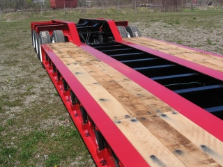 A unitized frame with heavy-duty full width cross members on 24