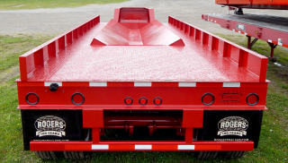 Trailer includes 2 volt LED lights, underride guard, and anti-sail mudflaps.  Deck surface is covered with 1/2 inch treadplate steel.