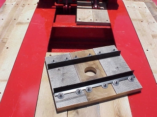 Deck toolbox with a wood cover is storage behind the gooseneck.