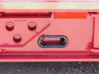 Controls for the Safety Lights package are on the driver's side of the deck.

The heavy-duty swinging side brackets are hooked in place until needed.