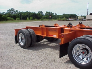 This booster axle assembly is designed so the trailing axle can be unpinned and connected directly to the trailer.

The booster creates up to a 14'-1