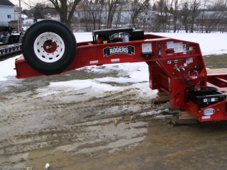 The gooseneck is equipped with several optional features:  spare tire & wheel carrier, hydraulic trapdoors, gooseneck support jack, and 2