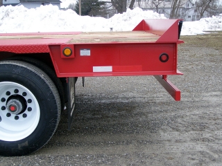 The level rear extension adds 49-inches of loading space to the deck without increasing the wheel base.

A vertical bumper guide welded to the rear channel is a visual guide to the back edge of the deck.

Air ride suspension has a mechanical height control.