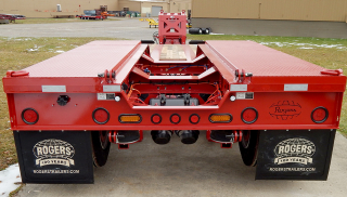 Several items are shown in this photo:
 - Welded treadplate wheel covers
 - Hinges and pins for connecting an optional 4th axle
 - LED Amber strobe lights
 - Axle air lift and air suspension dump valves