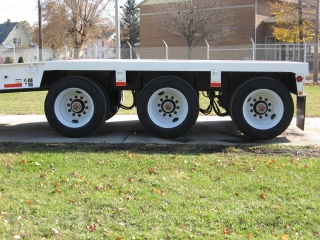 The tri-axle has air ride suspension with mechanical air height control and 255/70R tires on steel disc wheels.