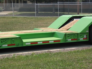 This special design of ROGERS wheel wells in a platform deck allows a rubber-tired machine an extra 10