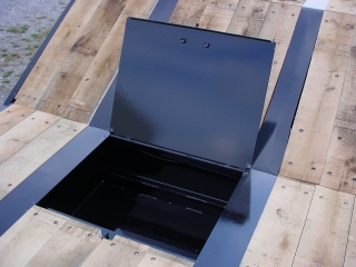 Standard deck toolbox with lockable steel lid is just behind the slope of the gooseneck; an optional oak lid is also available.