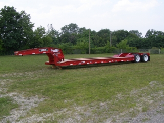 ROGERS CR35, the 35-ton capacity detachable gooseneck lowed.  ROGERS MH35, the 35-ton capacity fixed gooseneck rear loading trailer.  ROGERS TAG20XXL, the 20-ton capacity drawbar tag-along.