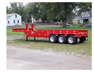 Rogers® 65-ton capacity trailer hauls steel coils between different processing areas of a steel mill during three shifts, seven days a week.  Equipped with interchangeable heat-resistant trays and a tarp, the trailer can haul different size coils during all kinds of weather.