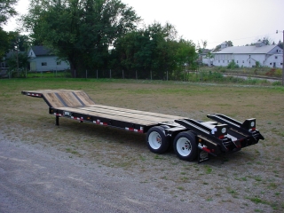 ROGERS CR35, the 35-ton capacity detachable gooseneck lowed.  ROGERS MH35, the 35-ton capacity fixed gooseneck rear loading trailer.  ROGERS TAG20XXL, the 20-ton capacity drawbar tag-along.