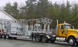 ROGERS® custom-built trailer, designed as a mobile substation for Unitil Energy Systems. The entire unit, including the tractor, had to weigh in at less than 99,000 pounds.