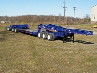 This custom rogers® 80-ton capacity, 13-axle trailer has a rocker shaft in the rear of the trailer that distributes weight to the rear six axles.